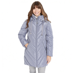 A woman wearing a light lavender-gray hooded puffer jacket with a chevron quilted pattern, standing against a plain white background.