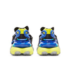 A pair of chunky sneakers shown from the back, featuring a bright neon yellow and blue design with black details and gray soles, set against a plain white background.