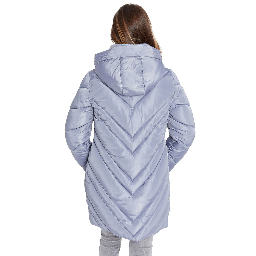 A woman viewed from the back wearing a light lavender hooded puffer jacket with a chevron quilted pattern, set against a plain white background.