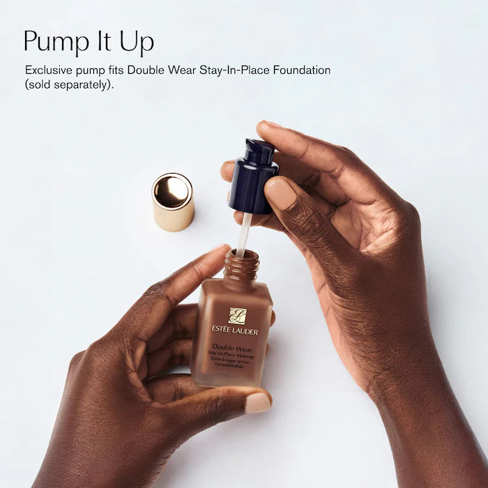 Estée Lauder foundation bottle with pump being used, on a light background