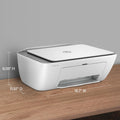 White printer on a wooden surface with dimensions indicated