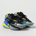 Colorful sneakers with a brand logo on a light gray background